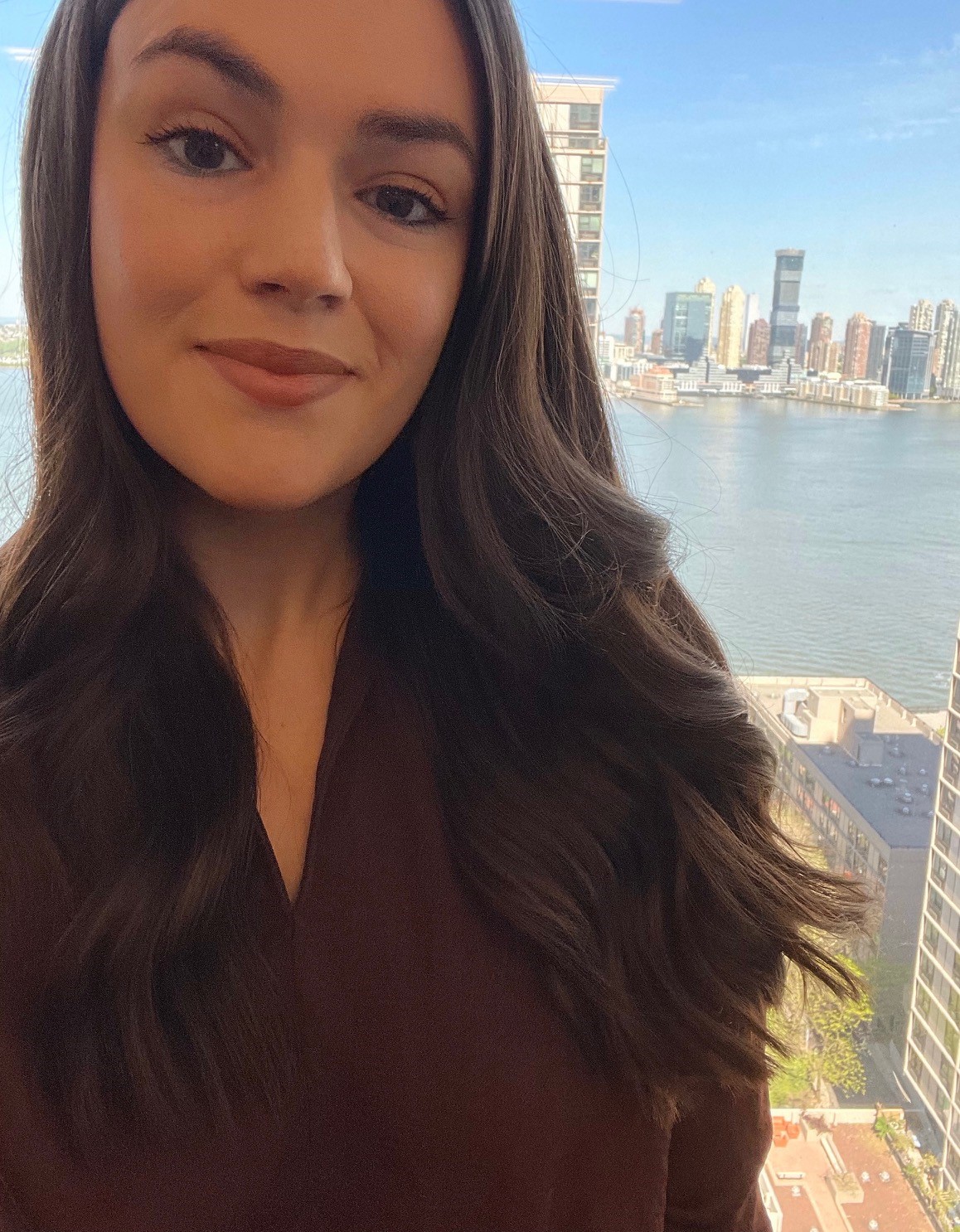 A photo of Laura Hudson with the Hudson River in the background