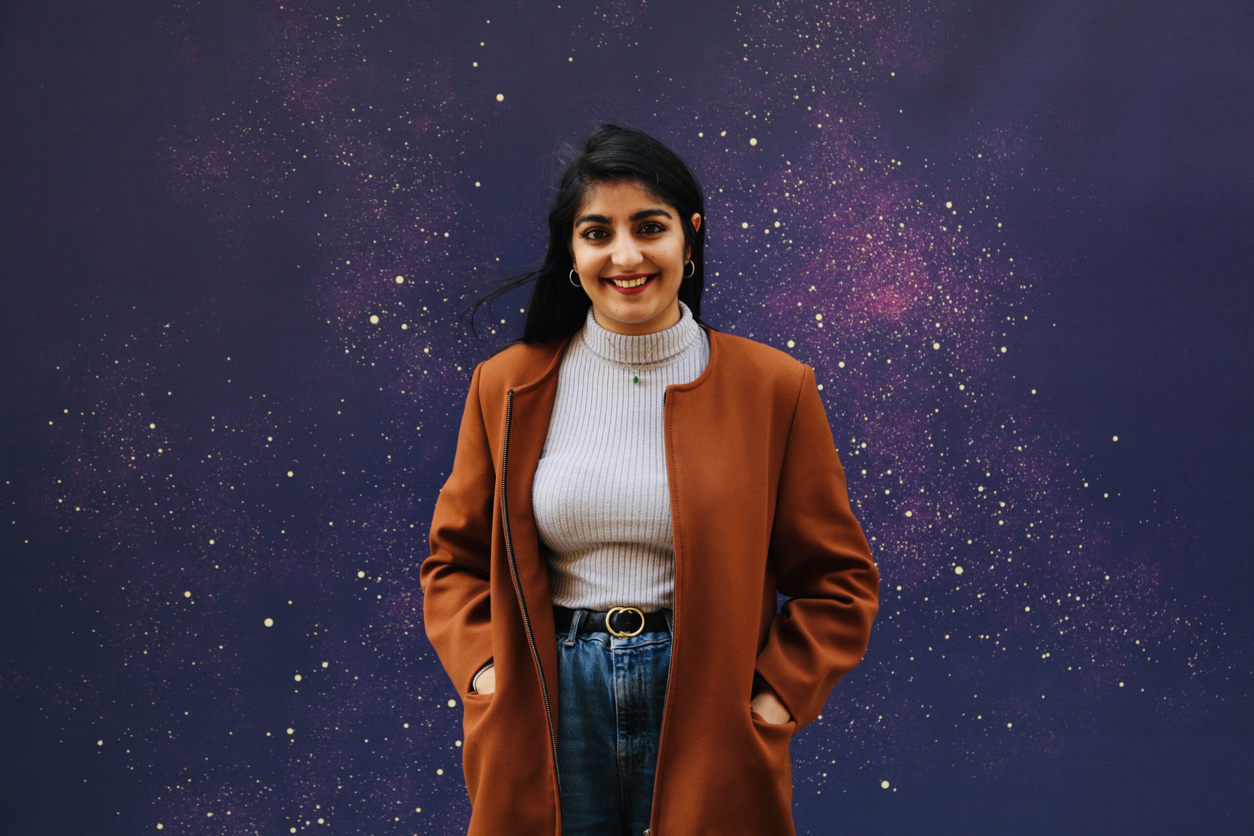 Photo of Ashni Lakhani against a starry background